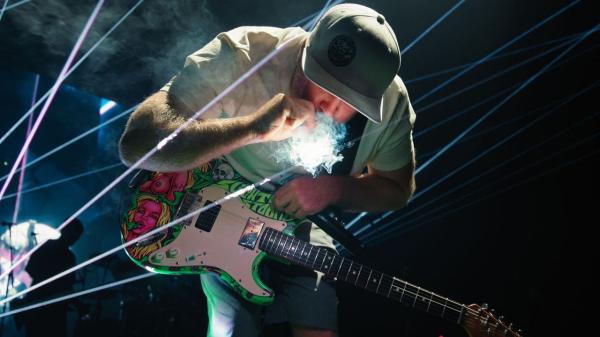 photo of Slightly Stoopid Lights Cannabis Joint With Laser At Texas Concert As Lawmakers Debate Hemp Ban image